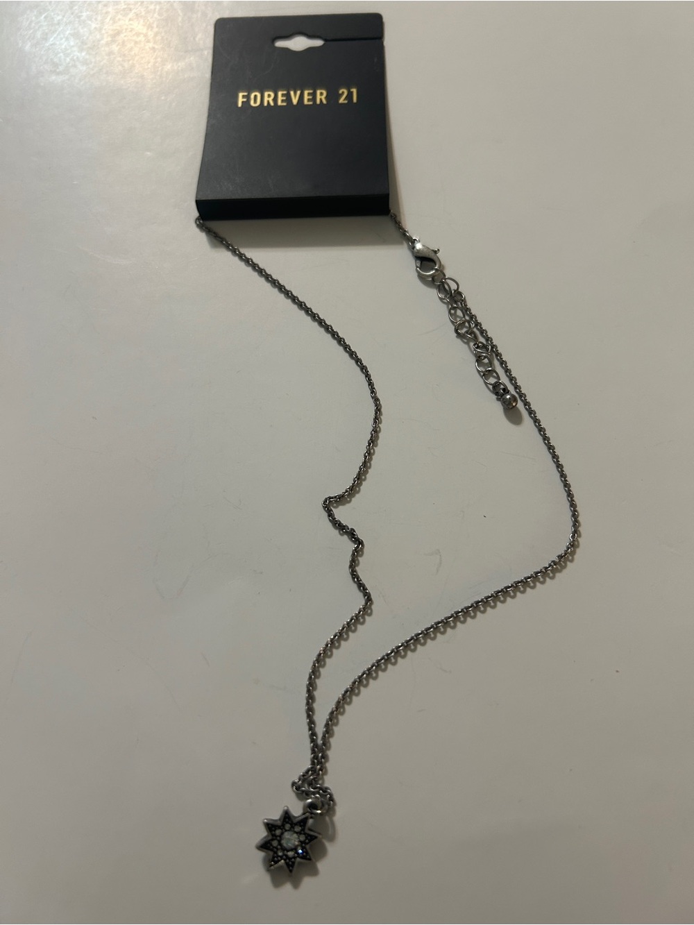 Forever 21 Silver Starburst Charm Necklace with Crystal Accent